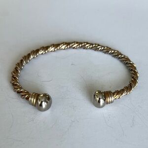 Elegant Gold and Silver Twisted Bracelet that has magnets on the end one missing